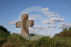 Old stone cross with sword symbol