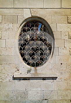 Old stone ellipse, round window brick wall background
