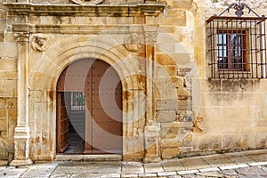 Old stone facade with wooden door