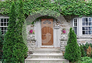 Old stone faced house covered in ivy