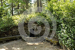 Old stone fontain at Pedras Salgadas natural park and traditional spa in the north of Portugal photo