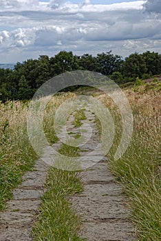 The Old Stone footpath crossing The Chevin above the market Town of Otley