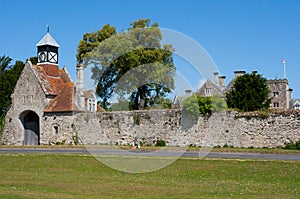 Old stone gatehouse with Tudor Clock Tower at the entrance to Beaulieu Abbey in the New Forest in the south of England