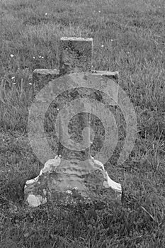 Old stone gravestone cross weathered