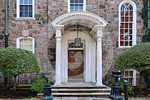 Old stone house with portico entrance