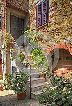 Old stone house with stairs, Tuscany, Italy.