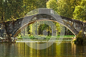 Old stone hump-back bridge in Gatchina. Russia