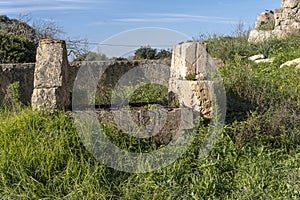 Old stone irrigation ditch and well in disuse