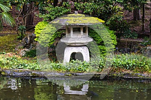 old stone lantern in a public park in Ashikaga, Japan