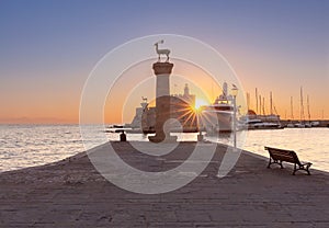 Old stone lighthouse in Fort St. Nicholas in Rhodes early in the morning