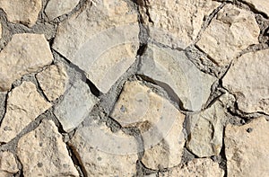 Old stone masonry with cement mortar texture background