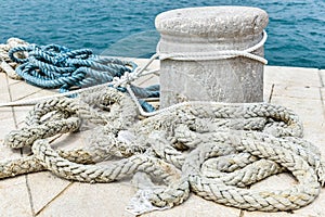 Old Stone Mooring on a stone paved pier