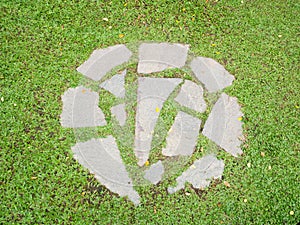 Old stone pavement with green grass