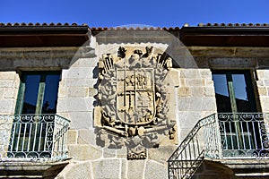 Old stone pazo house with big coat of arms. Casa do Escudo, Verin, Orense, Spain.