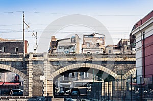 Old stone port bridge Archi della Marina  in Catania, Sicily, Italy photo