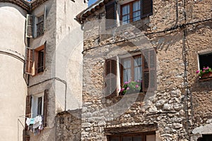 Old stone residential building in street in ancient town