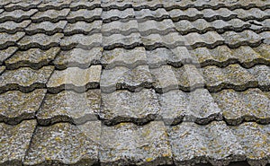 Old stone roof tiles texture. Obsolete roof covering buildings