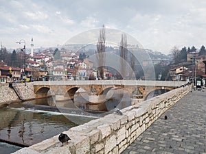 Old stone Seher Cehaja bridge over Miljacka river in Sarajevo