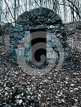 Old Stone Shelter on Barren Mountainside With Bare Trees