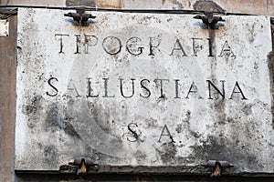 Old stone sign of Tipografia Sallustiana, Rome, Italy photo
