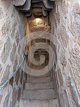 Old stone spiral staircase in banos de la encina castle photo