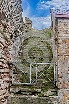 An old stone staircase leading to the sky