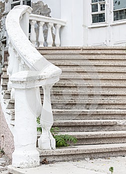 Old stone stairs at an abandoned old building. Selective focus