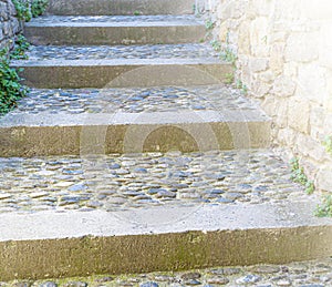 Old stone stairs on soft sunlight. Close up