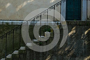 Old stone steps with wrought iron railings