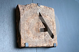 Old stone sundial on a wall