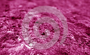 Old stone surface with blur effect in pink tone