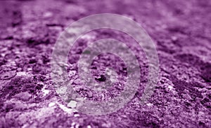 Old stone surface with blur effect in purple tone