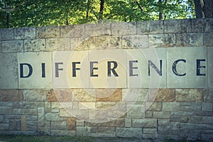 Old stone texture of Difference word on wall brick