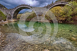 The old stone three arch bridge of Plakida or Kalogeriko, Zagori, Ioannina in Epirus Greece