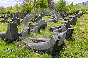 Old stone tombstones on ancient Jewish cemetery in sunny day