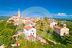 Old stone town of Buje on green hill panoramic view