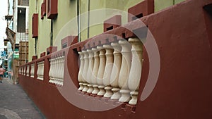 Old stone wall in an ancient mexican city. Fence brown color