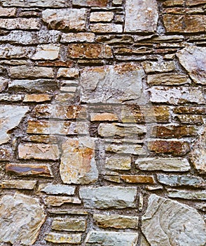 Old stone wall background cobblestones