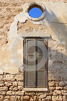 Old wall shutters opening view blue sky, Neve Tzedek, Tel Aviv photo