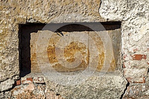 an old stone wall with a deepening rectangular shape