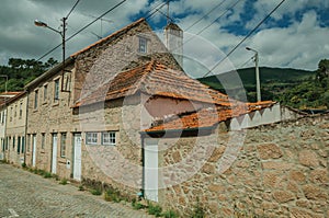 Old stone wall house with wooden door