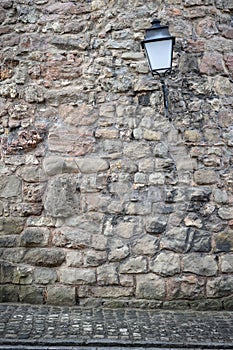 Old stone wall with lantern