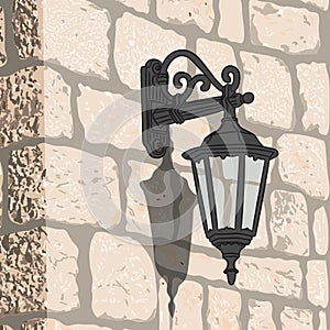 Old stone wall with a lantern.