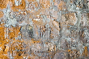 Old stone wall with orange braids