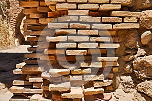 Old stone wall of Santa Barbara castle in Alicante, Valencia pro