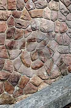 An old stone wall with sparrows