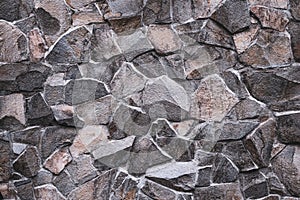 Old stone wall of stones in abstract style. Grunge background. Marble texture. Abstract retro art. Brick backdrop