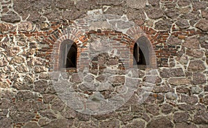 Old stone wall with two windows