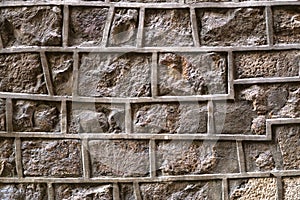 Old stone wall with uneven decorative joints