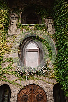 Old stone wall with a wedding decorated window